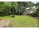 Spacious backyard featuring mature trees and a well-maintained lawn at 1900 Union St, Charlotte, NC 28205