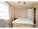Comfortable bedroom featuring wood floors, a ceiling fan, and natural light, perfect for relaxation and rest at 1900 Union St, Charlotte, NC 28205