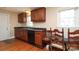 Cozy kitchen with wooden cabinets and a breakfast nook by a bright window at 1900 Union St, Charlotte, NC 28205