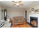 Classic living room with hardwood floors and fireplace, with a glimpse of front entry at 1900 Union St, Charlotte, NC 28205