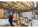 Unfinished basement shows exposed wooden beams and joists, with an array of stored items visible at 1923 Tracy Ct, Fort Mill, SC 29708