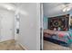 View from hallway into the bedroom with colorful bedspread and decor at 1923 Tracy Ct, Fort Mill, SC 29708
