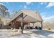 Spacious, covered car port area offering ample parking and storage, adjacent to the brick home at 1923 Tracy Ct, Fort Mill, SC 29708