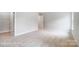 A bright bedroom with a neutral color palette and closet at 2003 Mantle Ridge Dr # 191, Wesley Chapel, NC 28079