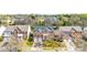 Aerial view of a residential neighborhood showcasing a brick two-story home with a two-car garage at 2014 Arbor Crest Ct, Charlotte, NC 28262