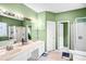 Green bathroom featuring a soaking tub and shower at 2014 Arbor Crest Ct, Charlotte, NC 28262