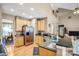 Modern kitchen with stainless steel appliances, wooden cabinets, and a breakfast bar, perfect for casual dining at 2014 Arbor Crest Ct, Charlotte, NC 28262