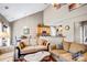 Open-concept living room with vaulted ceilings, seamlessly connecting the dining area and kitchen, ideal for gatherings at 2014 Arbor Crest Ct, Charlotte, NC 28262