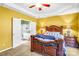 Spacious main bedroom with tray ceiling, ensuite bath, and decorative lighting exudes warmth and charm at 2014 Arbor Crest Ct, Charlotte, NC 28262