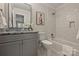 Bathroom featuring a granite countertop vanity, subway tile shower and tub, and modern fixtures at 2045 Driftwood Cir, Fort Mill, SC 29708