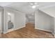 Large bonus room with hardwood floors, a ceiling fan, and an en-suite bathroom at 2045 Driftwood Cir, Fort Mill, SC 29708