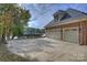 Two-car garage with concrete driveway, offering ample parking space and convenience at 2045 Driftwood Cir, Fort Mill, SC 29708