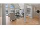 Spacious living room with large windows providing stunning lake views and natural light at 2045 Driftwood Cir, Fort Mill, SC 29708