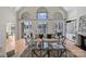 Open and bright living room with hardwood floors and expansive windows overlooking the lake at 2045 Driftwood Cir, Fort Mill, SC 29708
