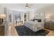Spacious main bedroom with bay windows, ceiling fan, and neutral decor at 2045 Driftwood Cir, Fort Mill, SC 29708