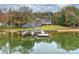 Expansive waterfront property with a private dock, gazebo and lush, mature trees surrounding the stately brick home at 2045 Driftwood Cir, Fort Mill, SC 29708