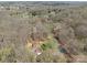 Aerial view of a charming home nestled among mature trees, showcasing its peaceful, secluded location at 220 Gregory Rd, Salisbury, NC 28147