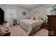 Bright bedroom with a large window, comfortable queen bed, and warm, inviting decor at 220 Gregory Rd, Salisbury, NC 28147
