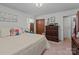 Well-lit bedroom with closet space and charming vintage-style dresser at 220 Gregory Rd, Salisbury, NC 28147
