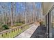 Wood deck offers a great space to relax and enjoy the privacy of the wooded backyard at 220 Gregory Rd, Salisbury, NC 28147