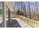 Large wooden deck, perfect for outdoor dining and relaxation, with views of the wooded backyard at 220 Gregory Rd, Salisbury, NC 28147