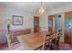 Dining room featuring wood furniture, floral wallpaper, and stained-glass door accents at 220 Gregory Rd, Salisbury, NC 28147