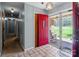 Bright foyer featuring a unique red front door with an adjacent hallway and outdoor view at 220 Gregory Rd, Salisbury, NC 28147