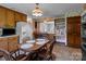 Eat-in kitchen with wood cabinets, a wooden dining table, and bright, natural light at 220 Gregory Rd, Salisbury, NC 28147