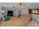 Open-concept living room with neutral walls, comfortable seating, and a view into the kitchen at 220 Gregory Rd, Salisbury, NC 28147