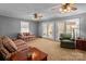 Spacious living room with comfortable seating, ceiling fans, and glass doors at 220 Gregory Rd, Salisbury, NC 28147
