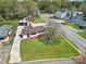 An aerial view shows this home's landscaping, detached garage, and convenient access to a main thoroughfare at 2301 Shamrock Dr, Charlotte, NC 28205