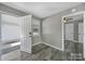 Entryway featuring hardwood floors, neutral paint, and access to the garage and back yard at 2301 Shamrock Dr, Charlotte, NC 28205