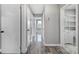 Hallway offers multiple rooms with hardwood flooring and neutral paint palette at 2301 Shamrock Dr, Charlotte, NC 28205