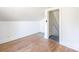 Attic featuring light walls, wood floor, and an entrance to another room at 260 Penninger Dr, Woodleaf, NC 27054