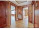 Open hallway with hardwood floors and doors leading to other rooms of the home at 260 Penninger Dr, Woodleaf, NC 27054