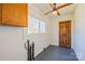 Bright laundry room with white walls, wood accent wall, window, and utility connections at 260 Penninger Dr, Woodleaf, NC 27054