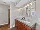 Bathroom features a double vanity, decorative mirrors, and modern fixtures in a well-lit space at 2709 Yadkin Ave, Charlotte, NC 28205