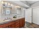 Bathroom featuring double vanity with granite countertops, updated fixtures, and modern lighting at 2709 Yadkin Ave, Charlotte, NC 28205