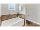Bathroom includes a bathtub with tiled walls and modern fixtures, offering a spa-like experience at 2709 Yadkin Ave, Charlotte, NC 28205