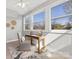 Bright bedroom featuring three windows, ceiling fan, and desk area with ample natural light at 2709 Yadkin Ave, Charlotte, NC 28205