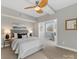 Well-lit bedroom includes ceiling fan and neutral-toned walls, creating a relaxing atmosphere at 2709 Yadkin Ave, Charlotte, NC 28205