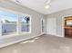 Bright bedroom features large windows and neutral carpet and paint at 2709 Yadkin Ave, Charlotte, NC 28205