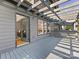 Large gray deck with pergola seamlessly connects indoor and outdoor living spaces with access to the living room at 2709 Yadkin Ave, Charlotte, NC 28205