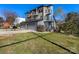 Attractive home showcasing a well-kept lawn, a two-car garage, and modern architectural details at 2709 Yadkin Ave, Charlotte, NC 28205