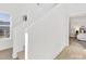 Bright hallway with staircase leading to a bedroom featuring carpet flooring and neutral paint at 2709 Yadkin Ave, Charlotte, NC 28205