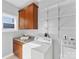 Functional laundry room with cabinets, counter space, modern washer and dryer units at 2709 Yadkin Ave, Charlotte, NC 28205