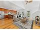 Cozy living room featuring an open layout, hardwood floors and bright, airy ambiance at 2709 Yadkin Ave, Charlotte, NC 28205