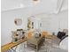 Bright living room with hardwood floors and stone accent wall features stylish furnishings and decor at 2709 Yadkin Ave, Charlotte, NC 28205
