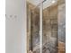 Shower featuring glass door, tile surround, and modern fixtures, offering a luxurious bathing experience at 2709 Yadkin Ave, Charlotte, NC 28205