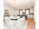 Open dining area features a round table, stylish chairs and an elegant chandelier at 3119 Knowlton Ln, Charlotte, NC 28205